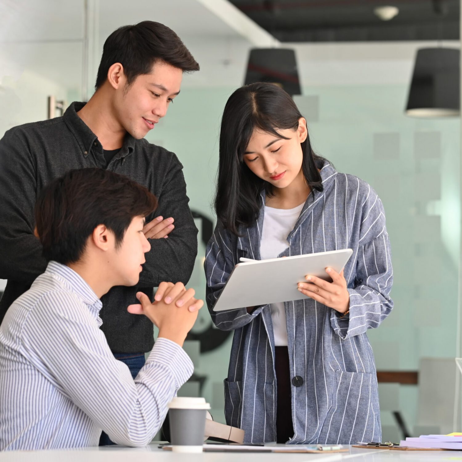 Team startup business discussion with tablet computer.